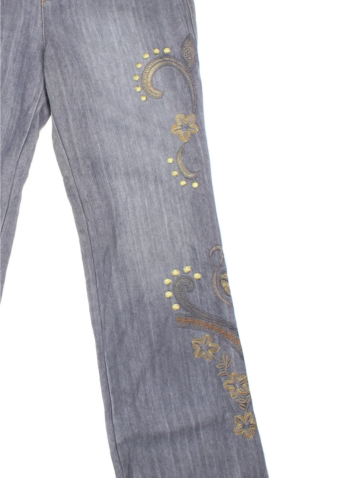 Y2K Embroidered Flared Jeans in grey colourway with multiple pockets, contrast stitching and floral detailing on the front/back.