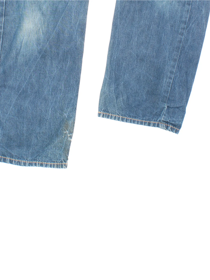 Vintage Levi Strauss Buckle Back Jeans in blue colourway with multiple pockets, buckle back feature and the logo embroidered on the back.