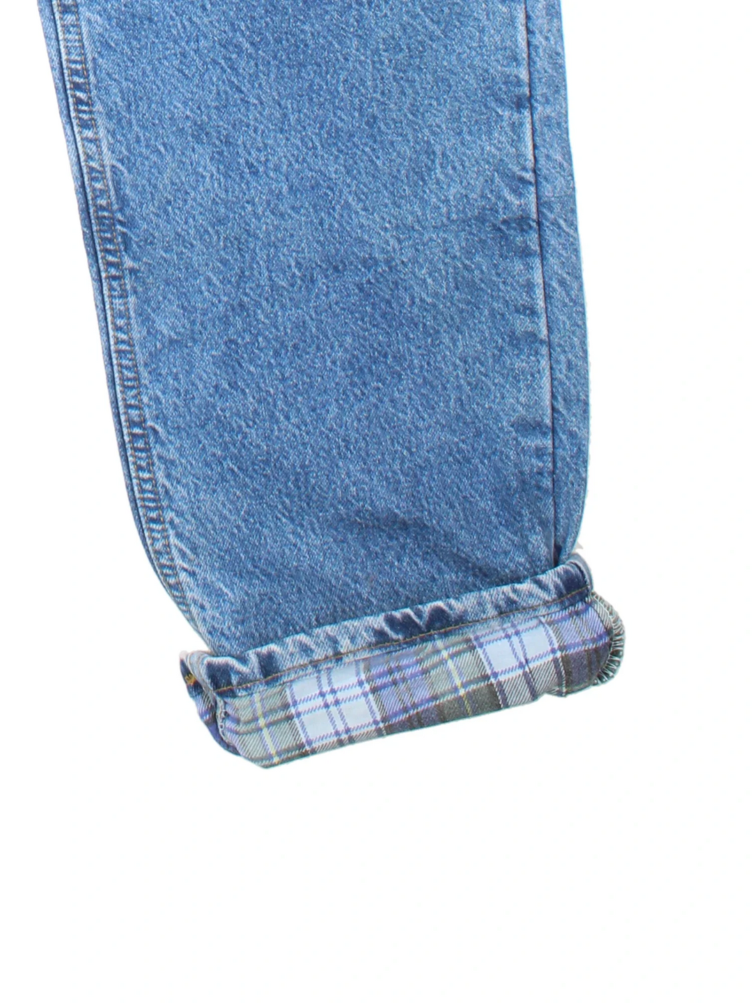 Carhartt Jeans in blue colourway with multiple pockets, plaid pattern lining, and the logo embroidered on the back.