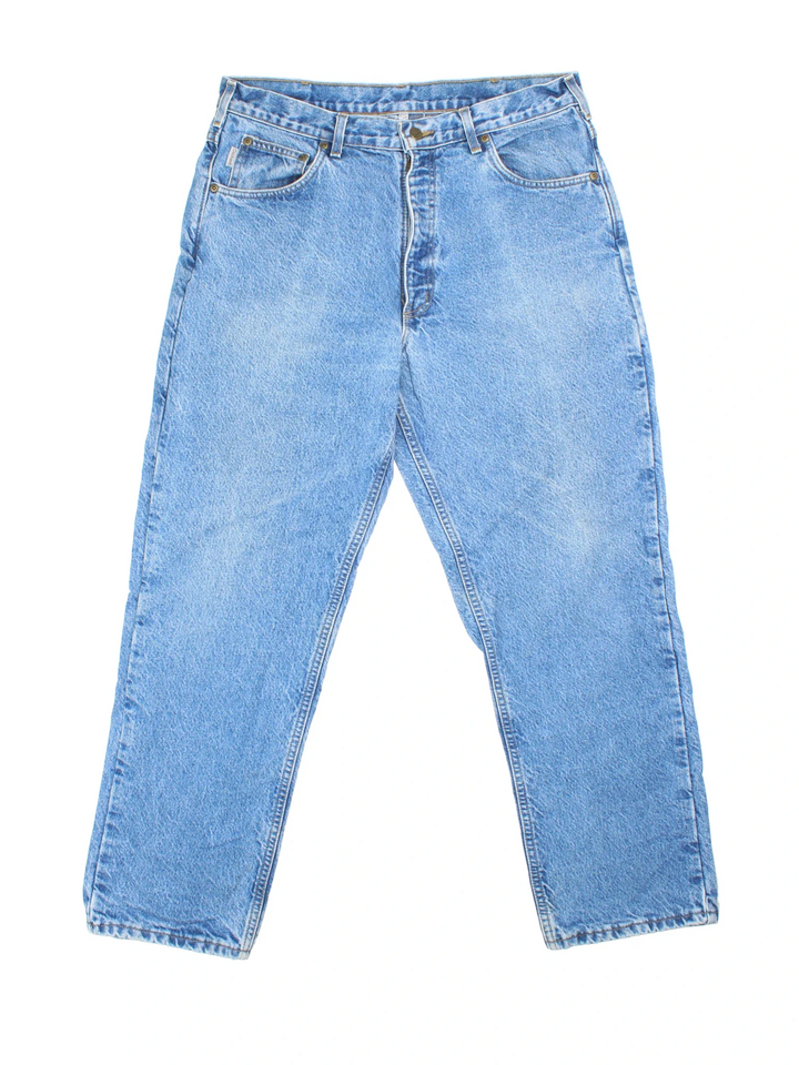 Carhartt Jeans in blue colourway with multiple pockets, plaid pattern lining, and the logo embroidered on the back.