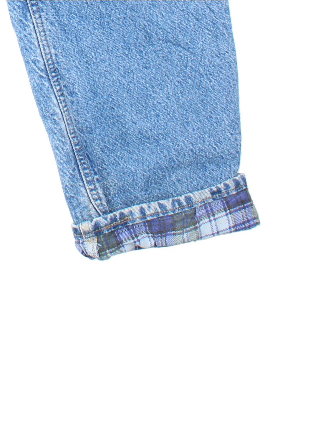 Carhartt Jeans in blue colourway with multiple pockets, plaid pattern lining, and the logo embroidered on the back.