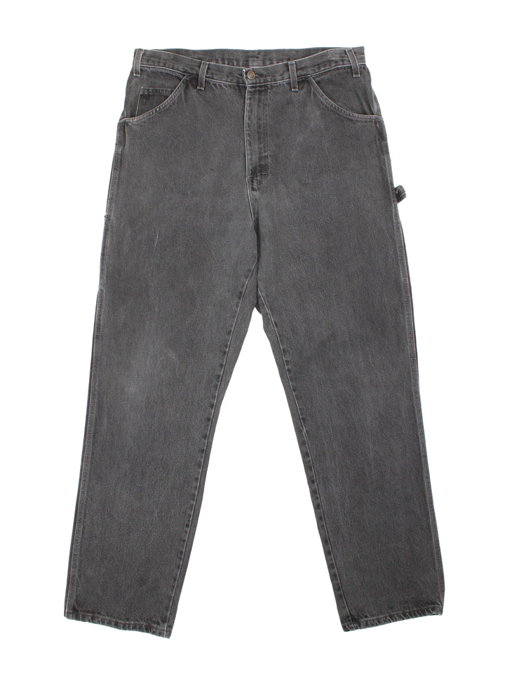 Dickies Carpenter Jeans in a dark grey colourway with multiple pockets and the logo embroidered on the back.