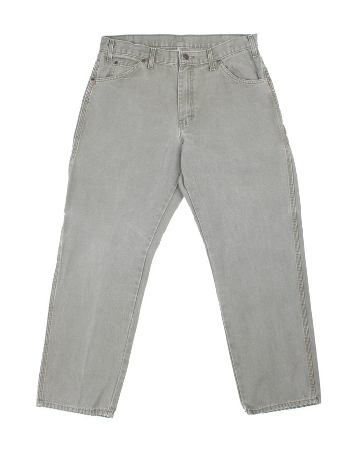 Dickies Carpenter Jeans in a green colourway with multiple pockets and the logo embroidered on the back.