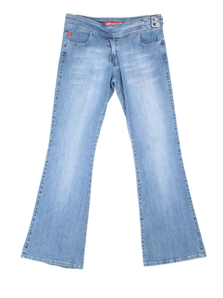 Y2K Punky Fish Flared Jeans in blue colourway with multiple pockets, buckle detail and branding on the front/back.