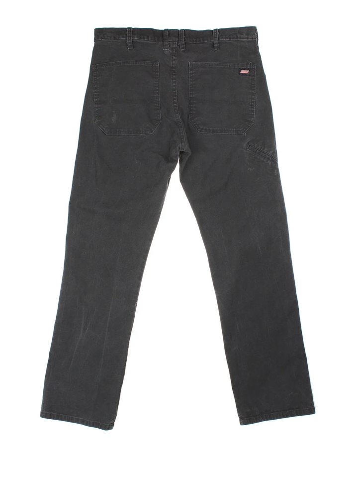 Dickies Jeans in black colourway with multiple pockets and branding on the back.