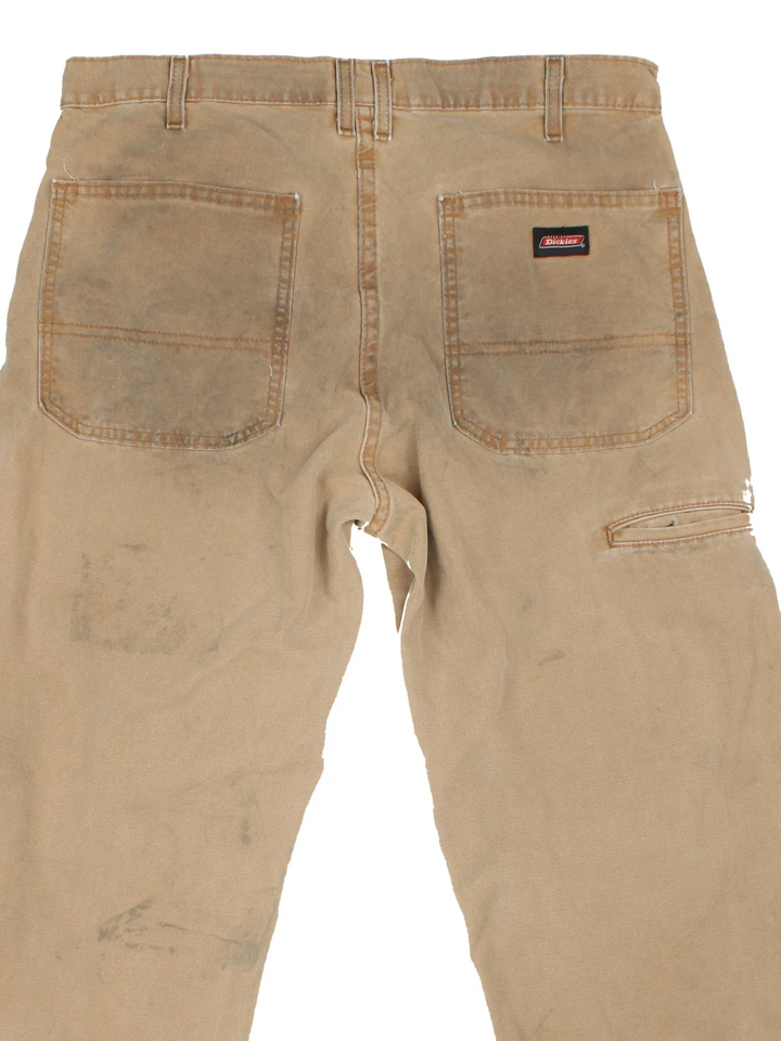 Dickies Carpenter Jeans in tan colourway with multiple pockets and branding on the back.