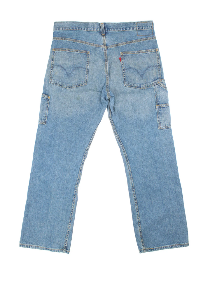 Levi Strauss Carpenter Jeans in blue colourway with multiple pockets and the logo embroidered on the back.