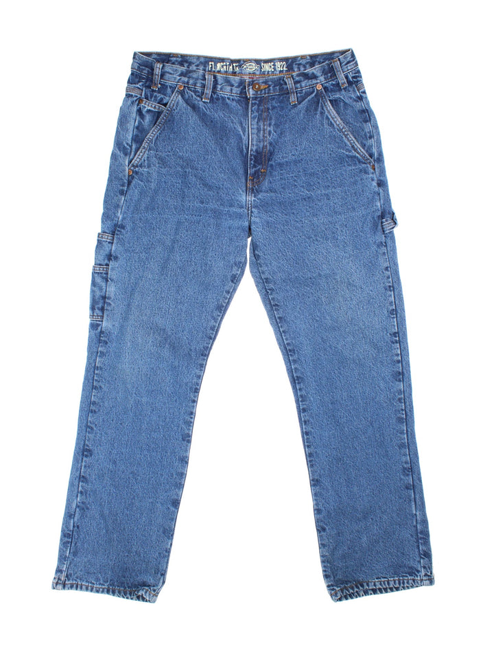 Dickies Lined Carpenter Jeans in blue colourway with multiple pockets, checked lining and the logo embroidered on the back.