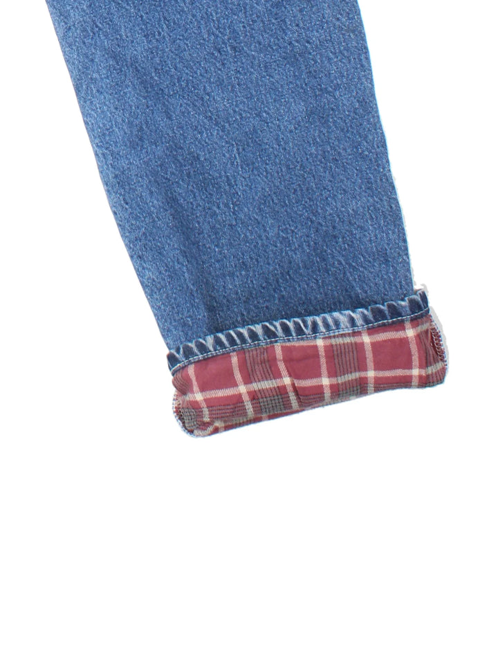 Dickies Lined Carpenter Jeans in blue colourway with multiple pockets, checked lining and the logo embroidered on the back.