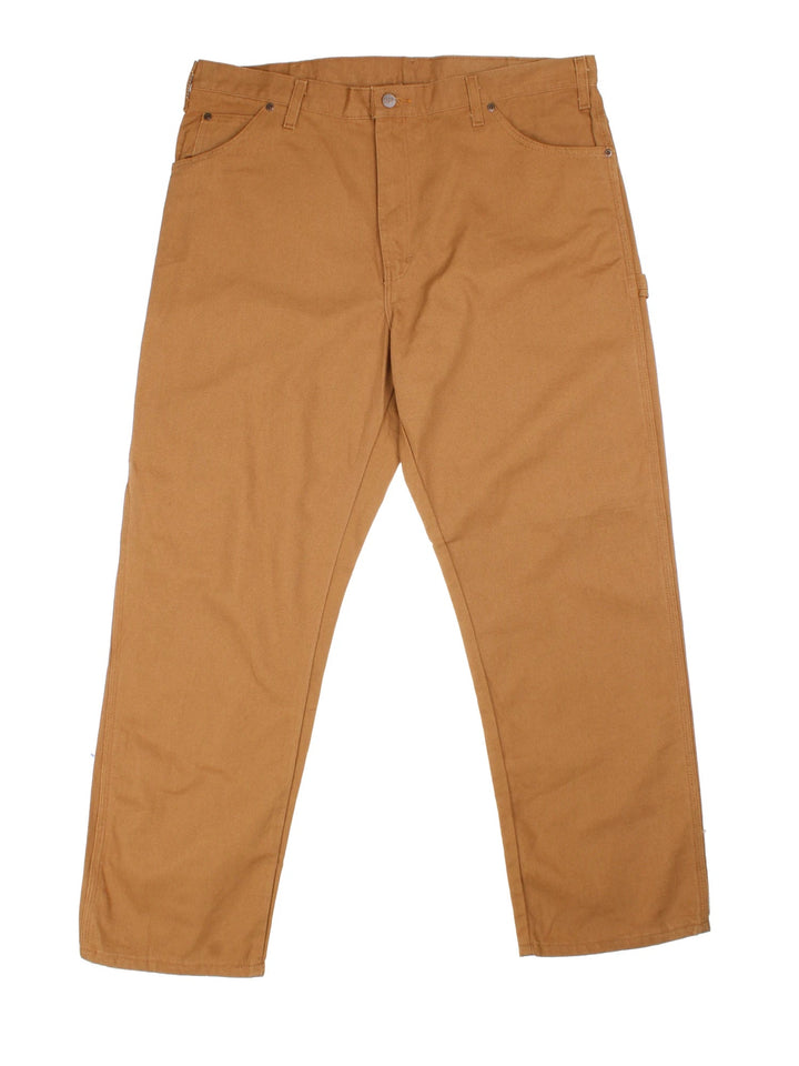 Dickies Carpenter Trousers in brown colourway with multiple pockets and the logo embroidered on the back.