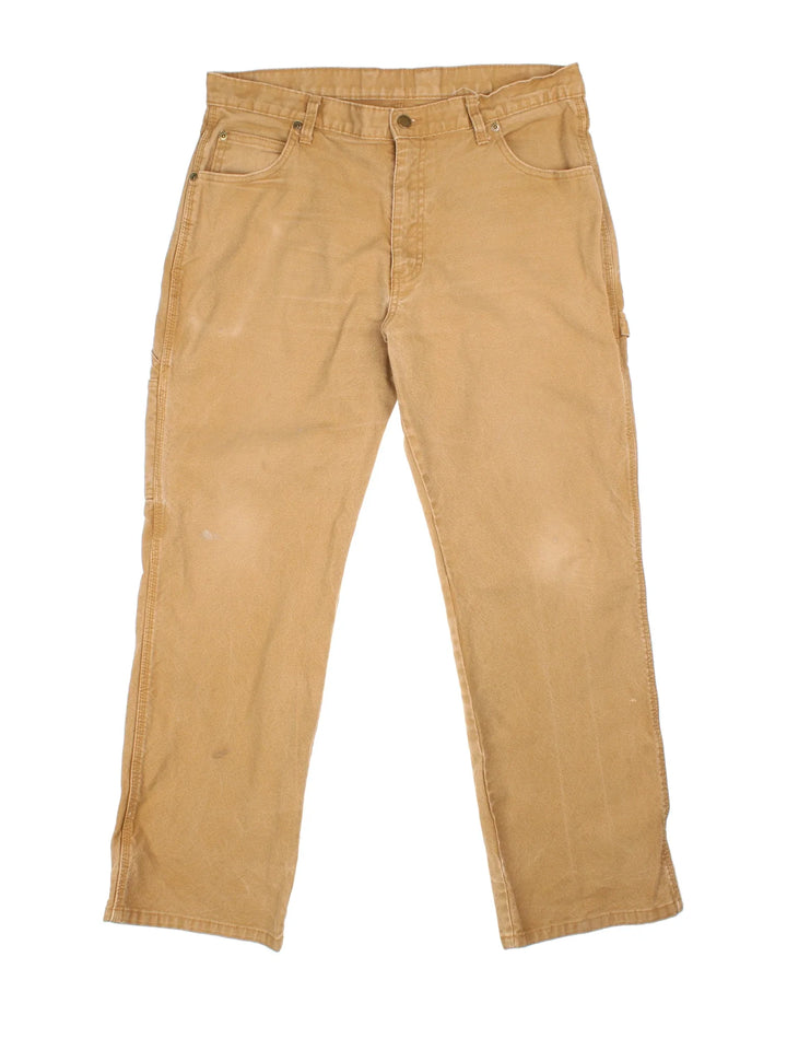 Dickies Carpenter Jeans in tan colourway with multiple pockets and the logo embroidered on the back.