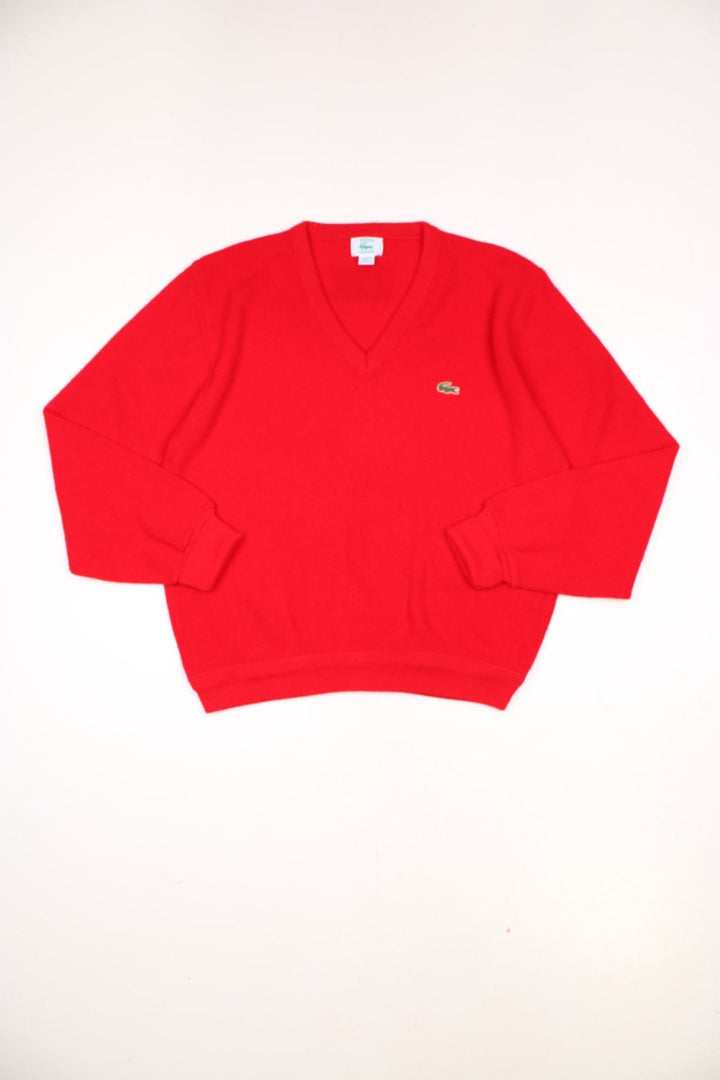 Vintage 70s Lacoste Izod knitted jumper in red. Features signature embroidered logo on the chest.