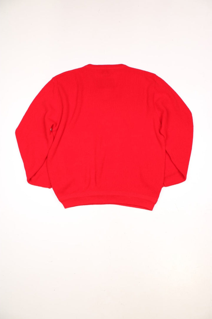 Vintage 70s Lacoste Izod knitted jumper in red. Features signature embroidered logo on the chest.