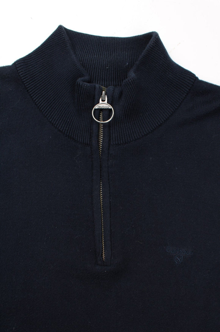 Barbour 1/4 Zip Jumper in a blue colourway. 1/4 zip fastening, ribbed side detail and embroidered logo on front.