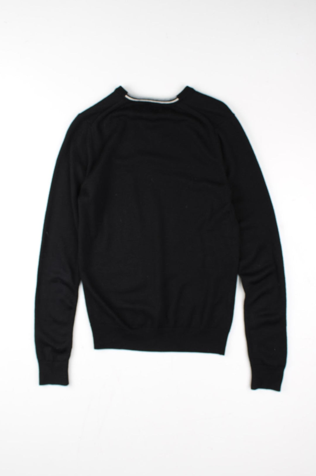 Fred Perry Jumper in a black colourway. V neck, with embroidered logo on front.