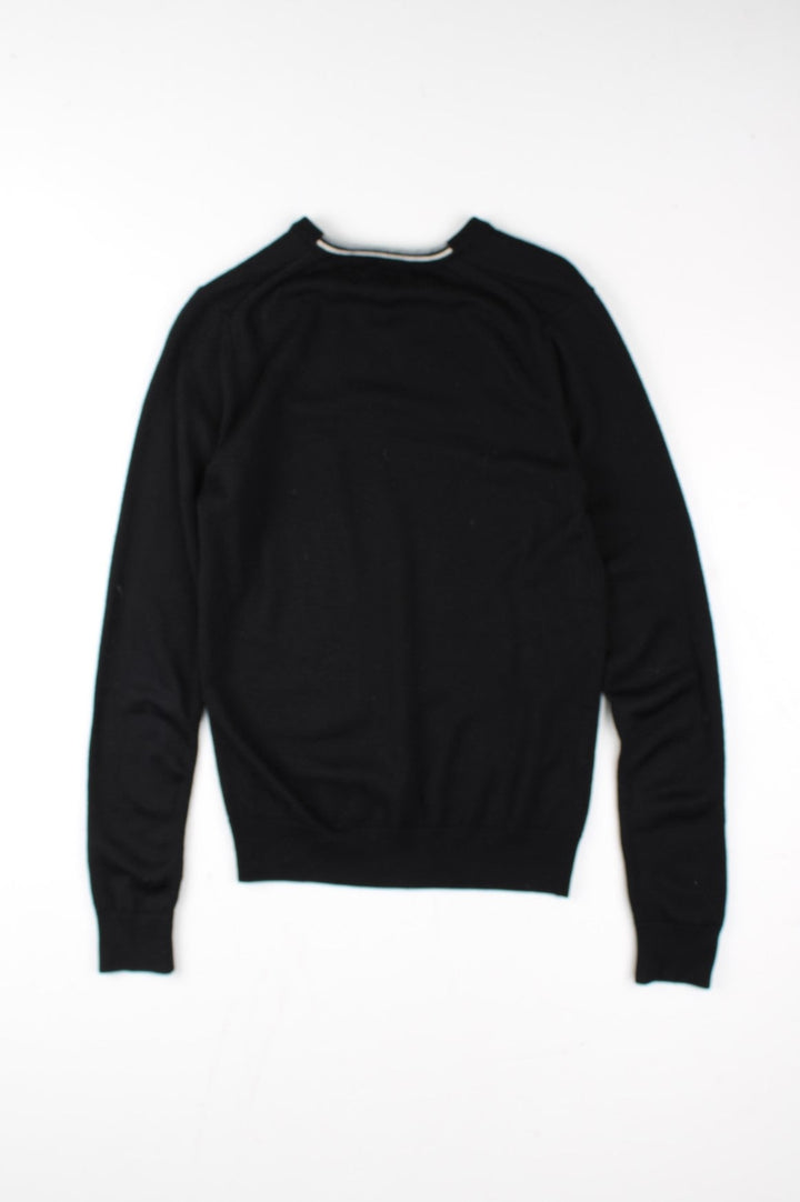 Fred Perry Jumper in a black colourway. V neck, with embroidered logo on front.