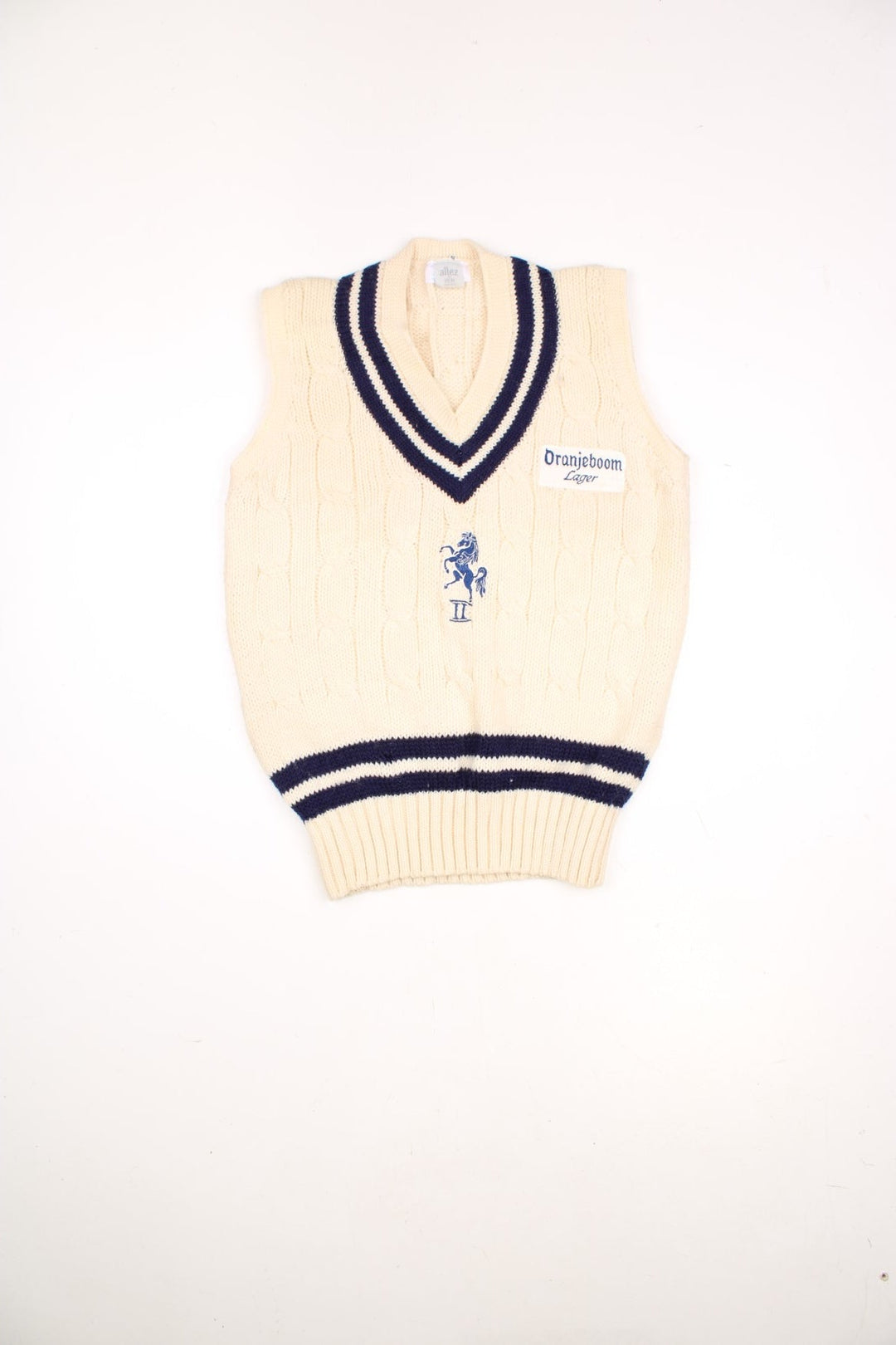 Vintage Allez by MCM sleeveless knitted cricket vest in white and blue. Features embroidered Oranjeboom Lager badge. 