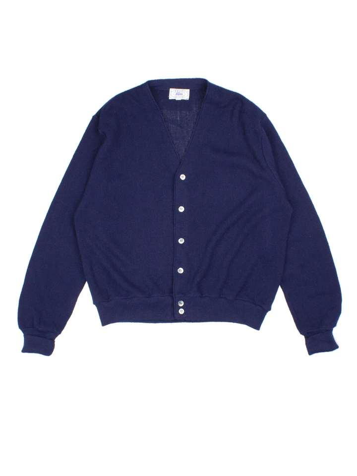 Vintage Lacoste Izod Cardigan in a blue colourway, button up close and has the logo embroidered on the front.