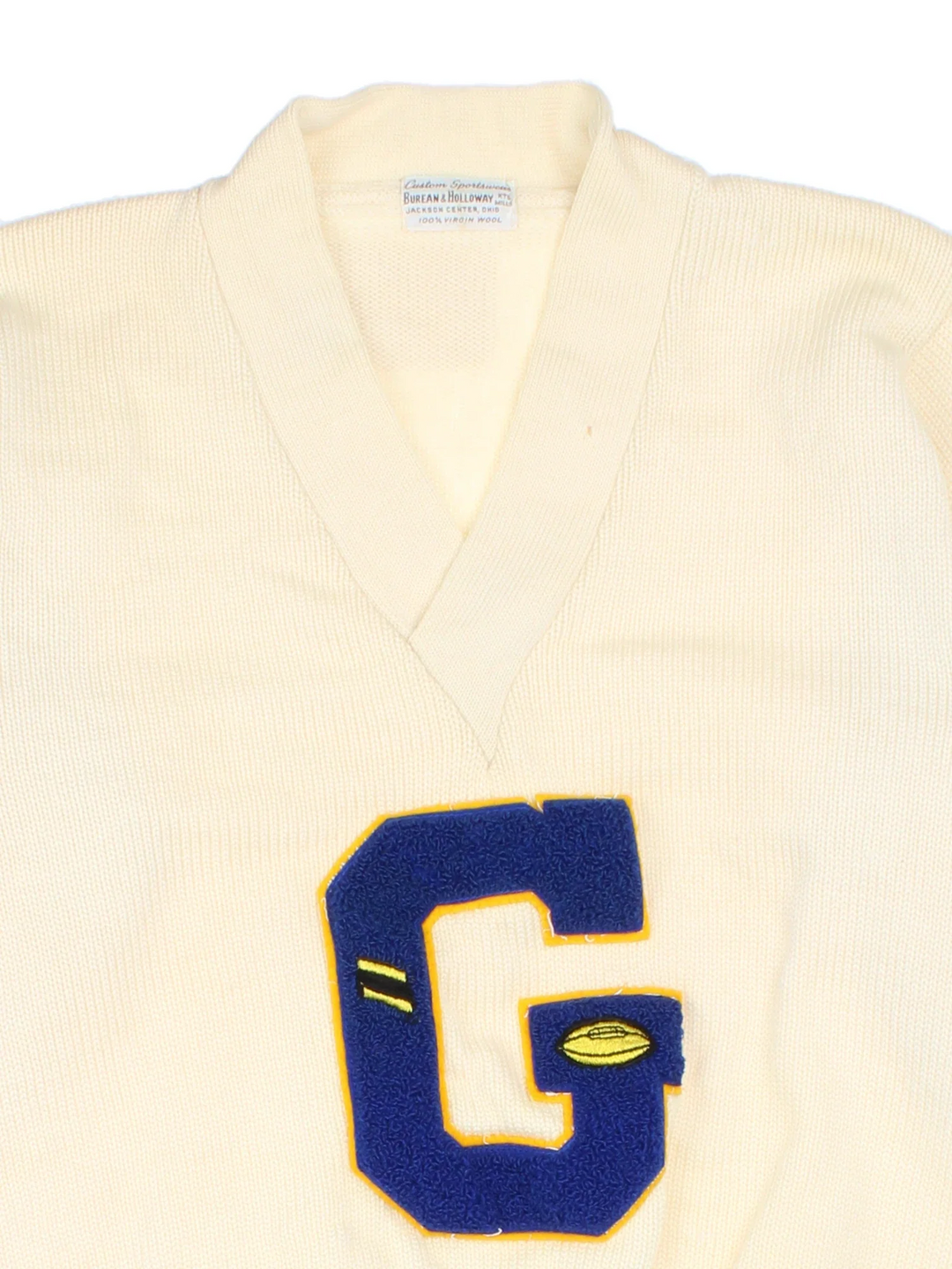 Vintage 1950's College Letterman Sweater in a tan colourway with a V neck collar and embroidered lettering on the front.