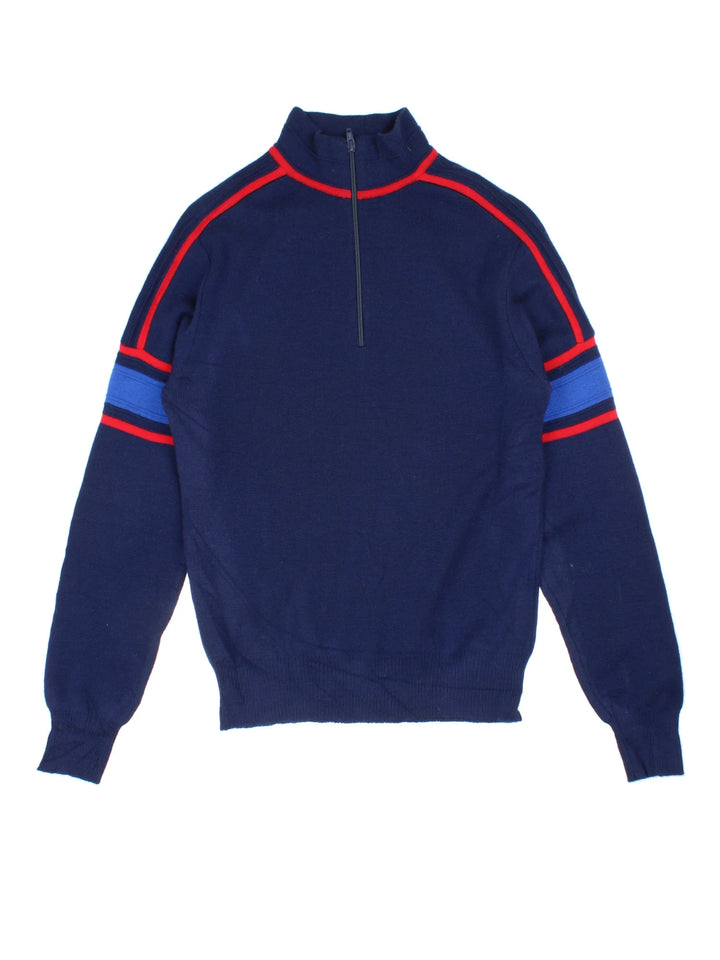 Vintage 1/4 Zip Jumper in a blue colourway with stripe detailing on the sleeves and shoulders.