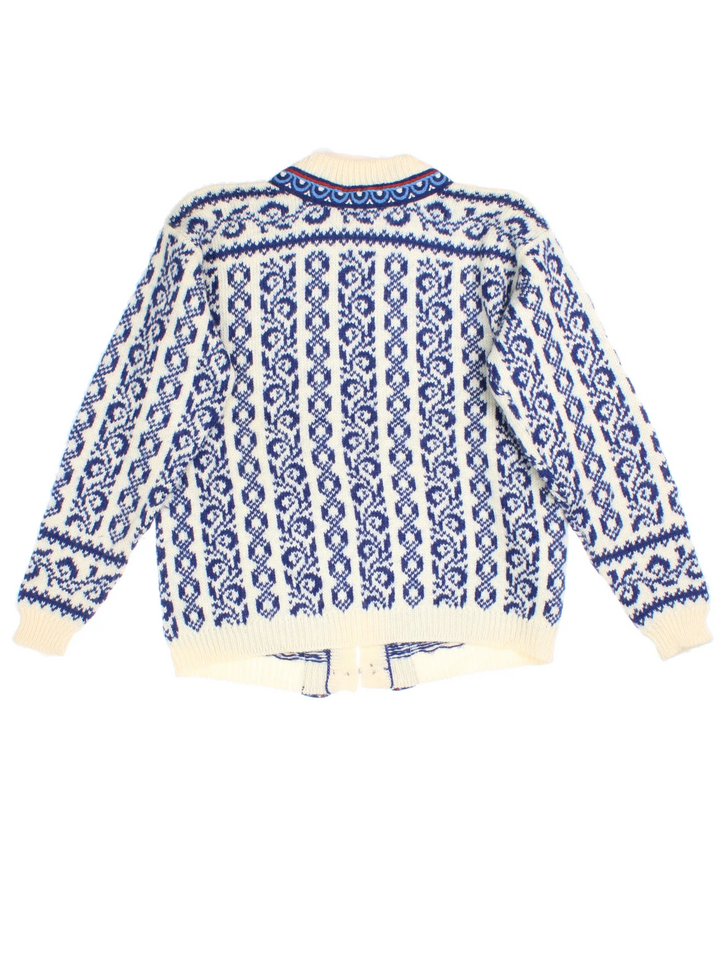 Vintage Dale Of Norway Cardigan in a tan and blue colourway with clasp closure and patterns all over.
