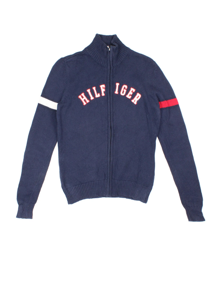90's Tommy Hilfiger Spell Out Zip Cardigan in a blue colourway with zip fastening and branding embroidered on the front.