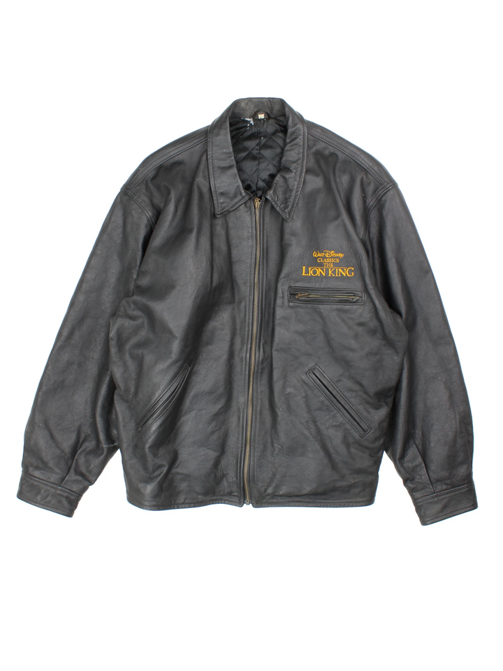 Vintage 1994 Disney Lion King Promo Leather Jacket in black. The jacket has a dagger collar, Lion King logo embroidered on the front panel and an interior pocket. The jacket is also lined with a quilted satin fabric. 
