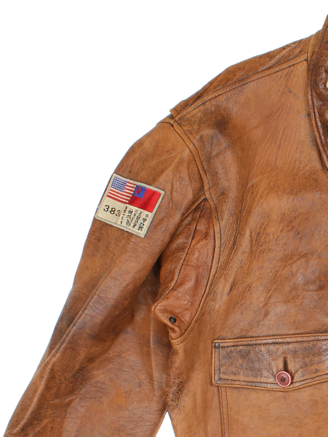 Vintage Avirex Flight Aviator Bomber Jacket in a brown colourway, zip up with side pockets and has badges embroidered on the front alongside the Avirex logo. 