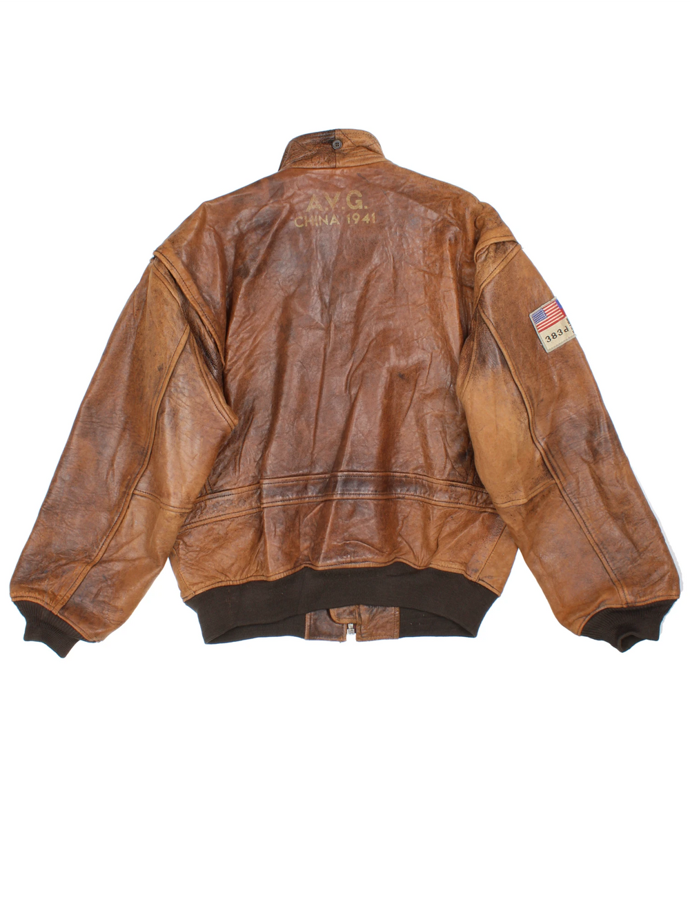 Vintage Avirex Flight Aviator Bomber Jacket in a brown colourway, zip up with side pockets and has badges embroidered on the front alongside the Avirex logo. 