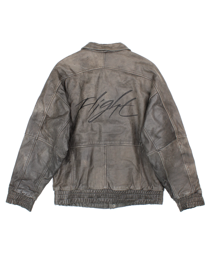 Vintage Nike Flight Air Jordan bomber jacket in brown. The jacket has the nike logo embroidered in black on the front, a large embroidered logo on the back, a zip to close and an interior pocket.  