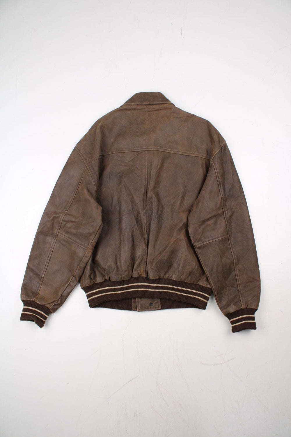 Vintage Mercedes Benz Leather Bomber Jacket in a brown colourway. Zip up fastening with side pockets, contrast cuffs/hem and embroidered branding on the front.