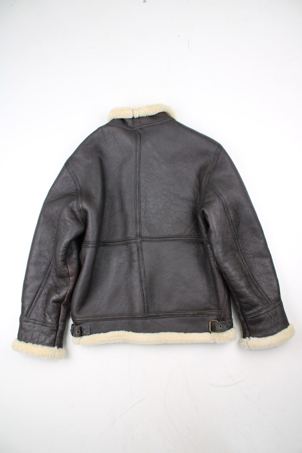 Vintage Shearling Aviator Jacket in a black colourway. Zip up fastening with side pockets, buckle details and shearling lining.