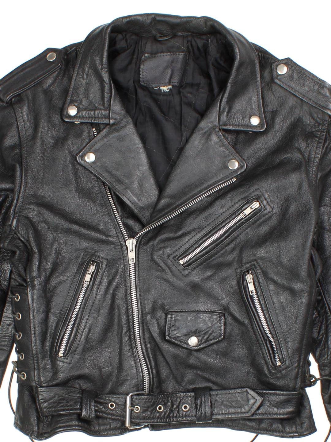 Vintage Leather Biker Jacket in a black colourway. Zip up with multiple pockets, classic biker detailing, buckle and lace detailing at the hem and side.