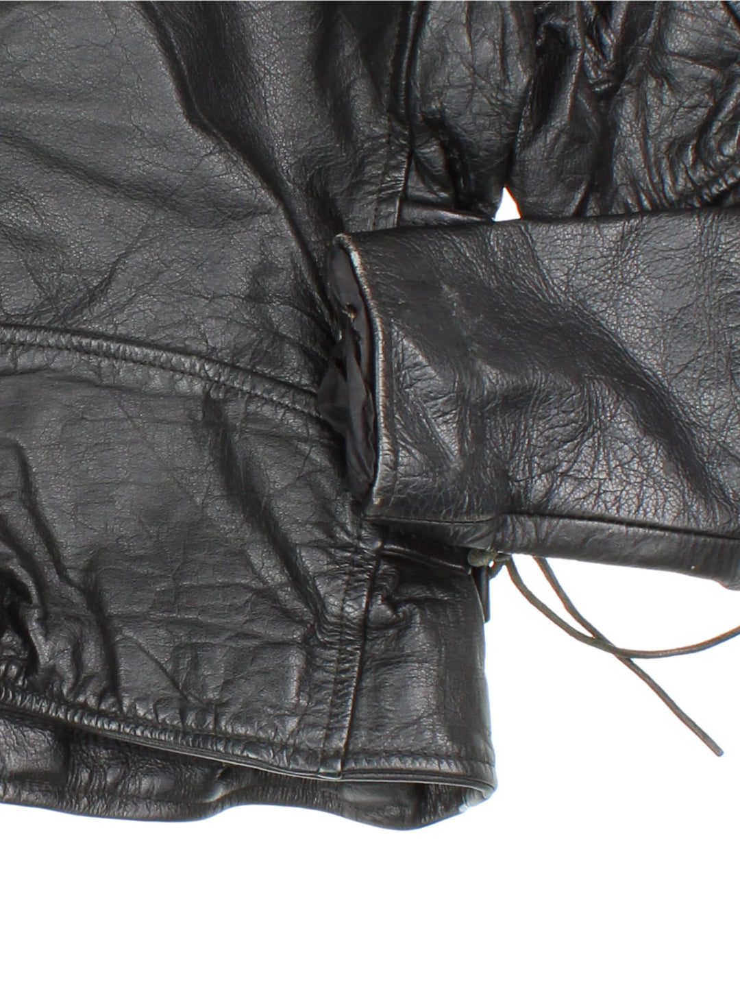 Vintage Leather Biker Jacket in a black colourway. Zip up with multiple pockets, classic biker detailing, buckle and lace detailing at the hem and side.