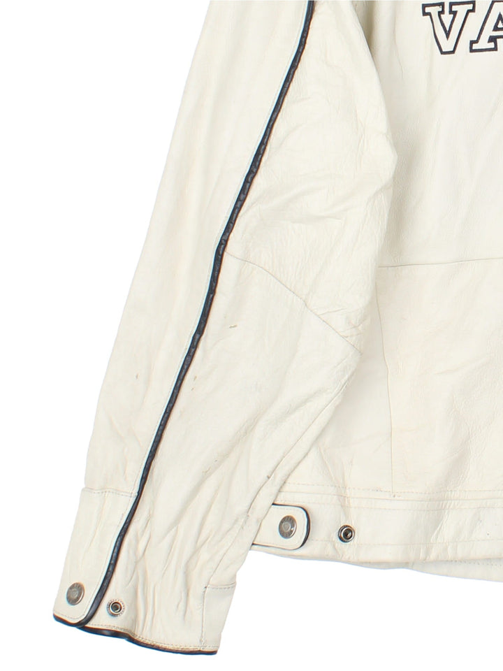 Vintage Guess 1981 Leather Jacket in a tan colourway. Full zip up with double pocket on the front. Varsity style lettering on the front and graphic on the back.