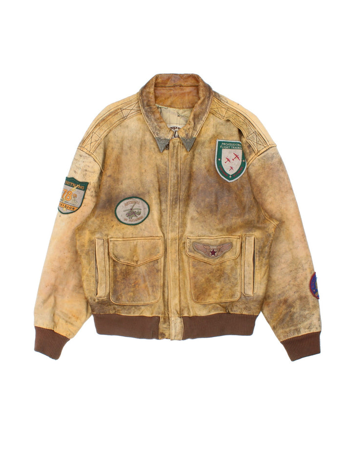 Vintage 90's Aviator Flight Leather Jacket in a brown colourway. Full zip up with double pocket on the front, Brown cuffed hem and classic aviator patches on the front and sleeves.