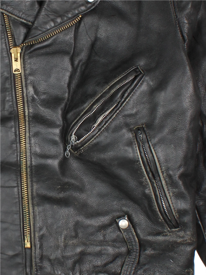 Vintage Leather Biker Jacket in a black colourway. Zips up and has multiple pockets.