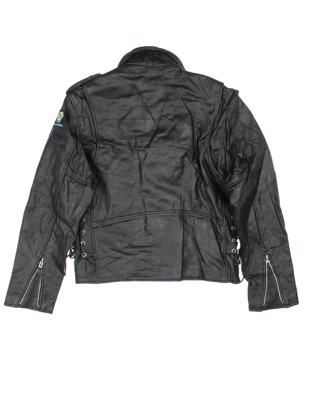Vintage Leather Biker Jacket in a black colourway. Zips up and has multiple pockets and Oklahoma badge on the left sleeve.