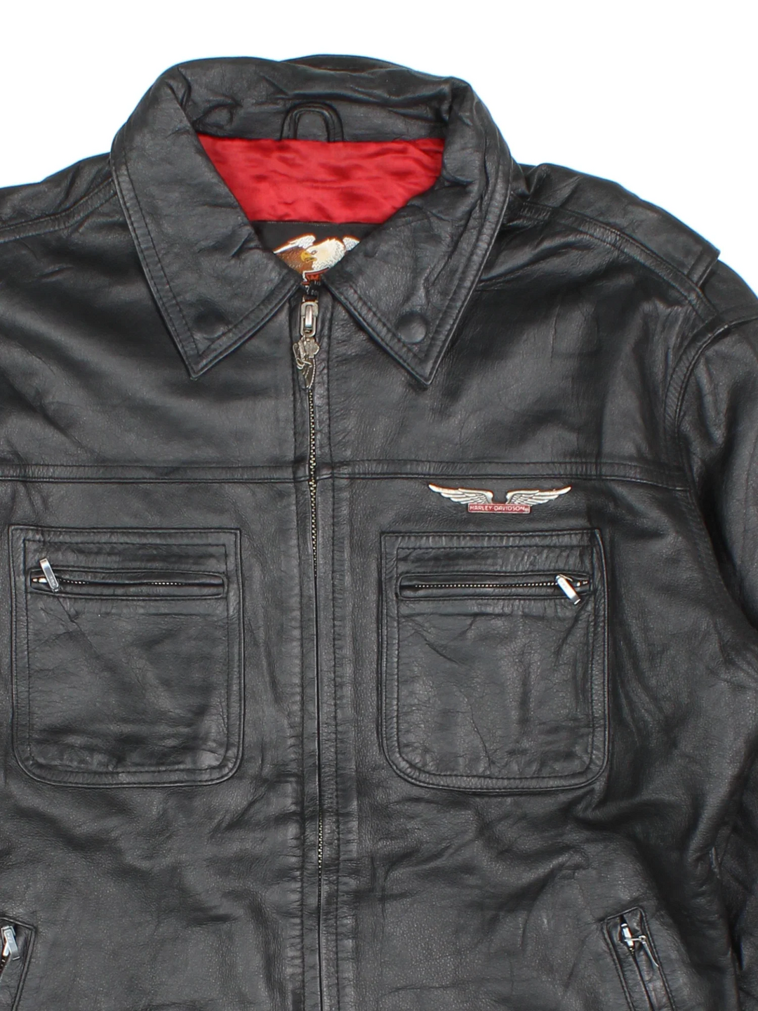 Harley-Davidson Leather Biker Jacket in a black colourway. Zips up and has multiple pockets and the logo tab embroidered on the chest.