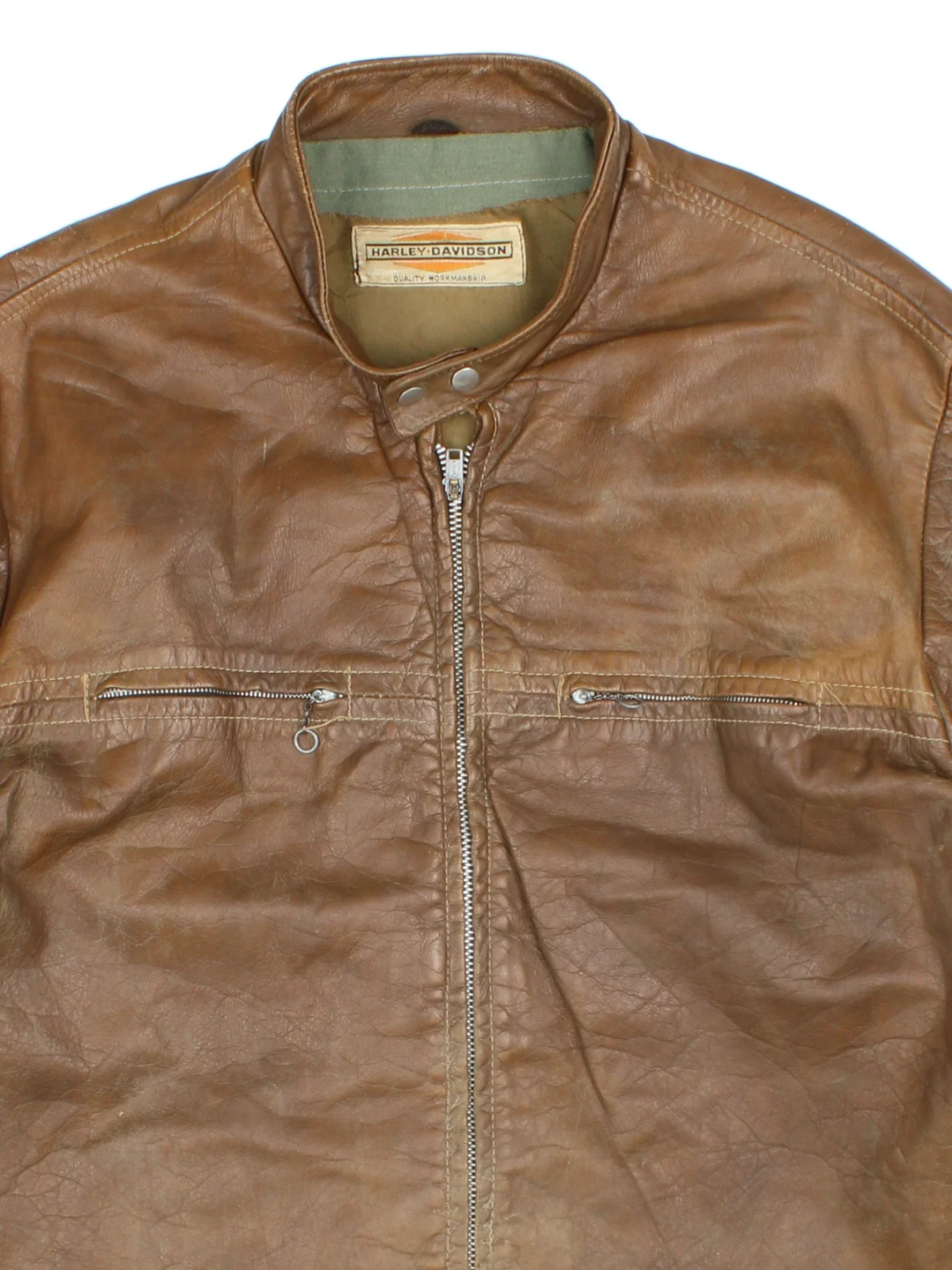 60's Harley-Davidson Leather Jacket in a brown colourway. Zips up and has double chest pockets.