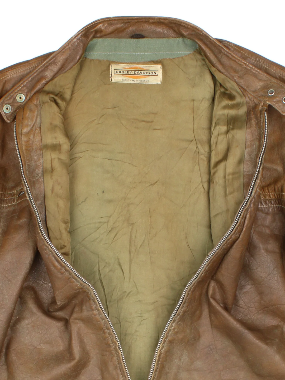 60's Harley-Davidson Leather Jacket in a brown colourway. Zips up and has double chest pockets.