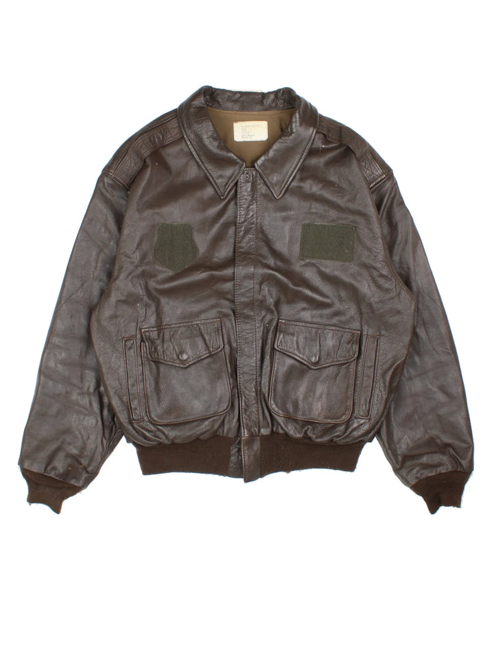 Vintage A-2 Leather Flight Jacket in a brown colourway. Zips up and has multiple pockets, and velcro patches from where badges once were.