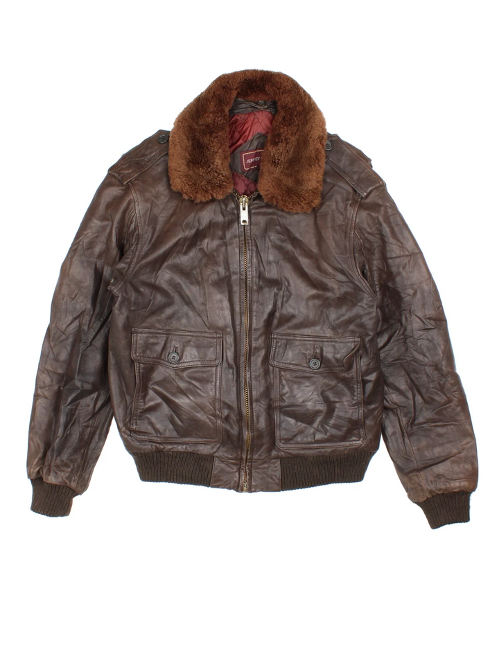 Vintage Leather Flight Jacket in a brown colourway. Zips up and has multiple pockets, and detachable fur collar trim.