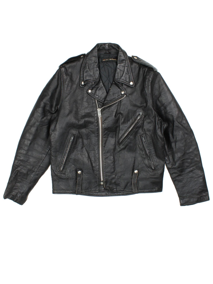 Vintage Harley-Davidson Motorcycle Jacket in a black colourway. Zips up and has multiple pockets, insulated with a quilted lining, and classic motorcycle detailing.