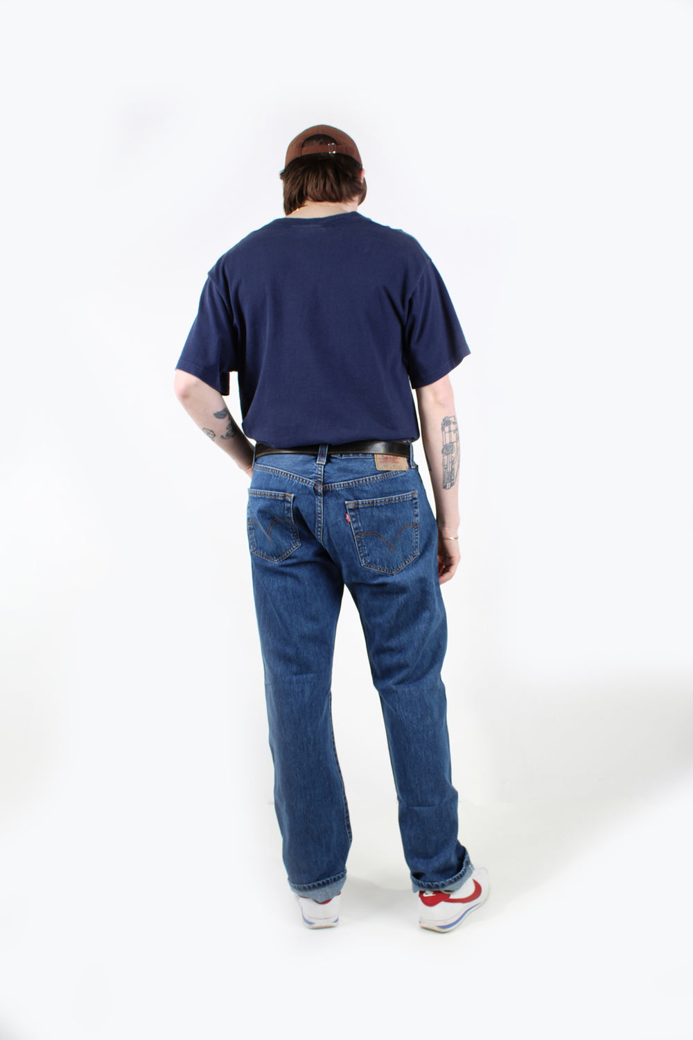 Vintage mid wash Levi Strauss 501 jeans straight leg with a button up fly, signature leather patch on the waist band