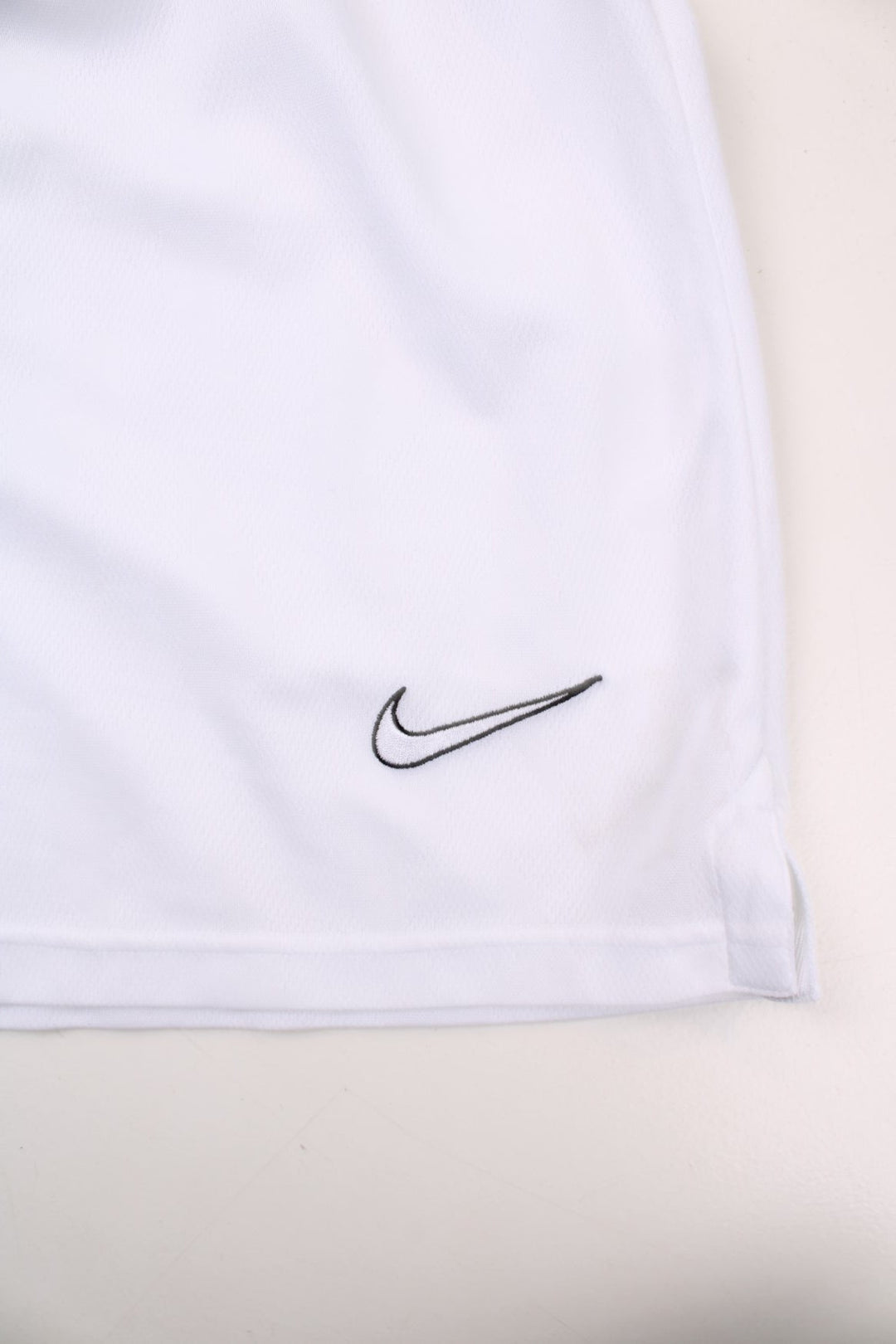 Nike shorts in white with an elasticated waist, and an embroidered logo on the front.