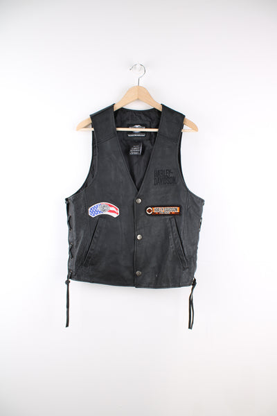 Harley-Davidson black leather button up motorcycle vest with embroidered badges 