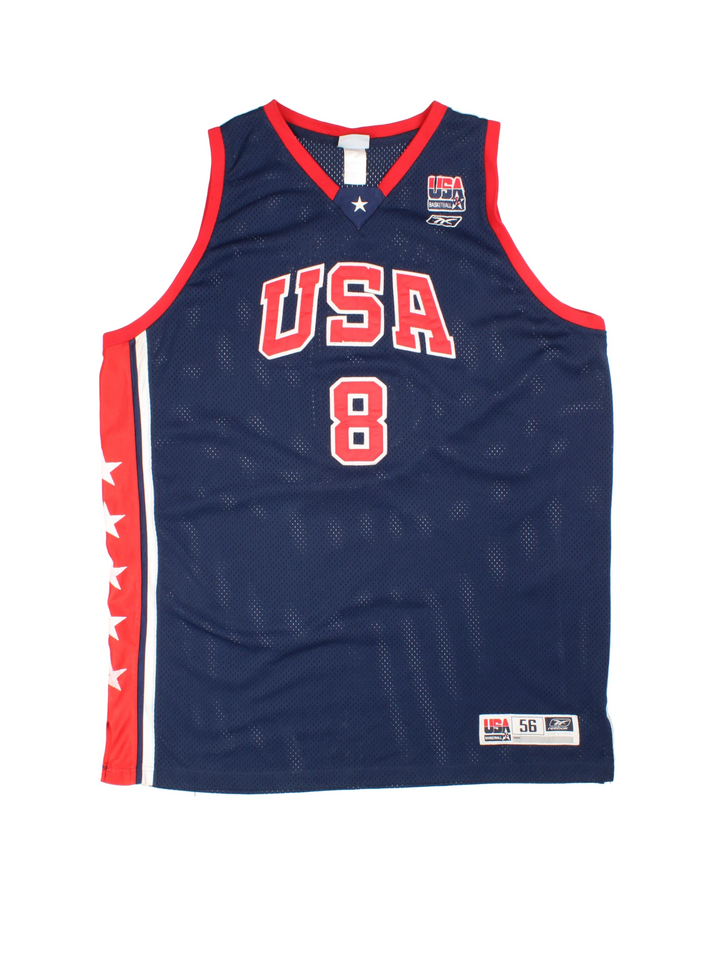 Vintage USA Dream Team Kobe Bryant Nike Basketball Jersey in a navy blue kit colourway, features embroidered logos and badge on the front, and on the back Bryant number 8.