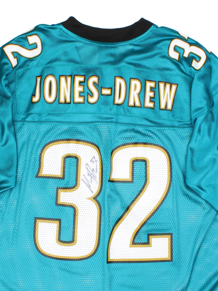 2009 Jacksonville Jaguars Maurice Jones-Drew #32 jersey. Signed on the back, made by Reebok. Still has original tags, features printed letters/ numbers.