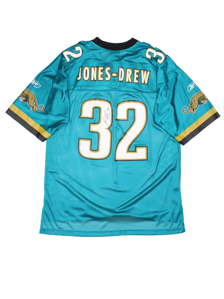 2009 Jacksonville Jaguars Maurice Jones-Drew #32 jersey. Signed on the back, made by Reebok. Still has original tags, features printed letters/ numbers.